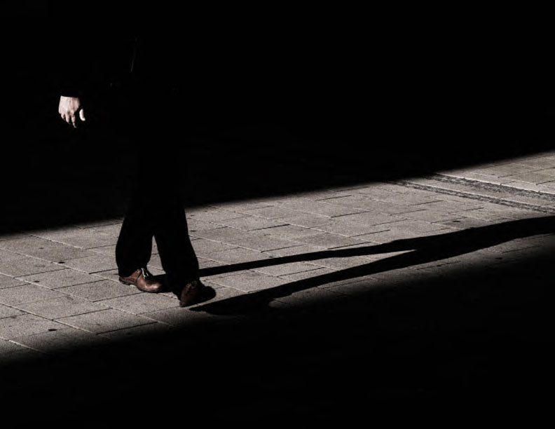 A shadowy man walking in the shadows